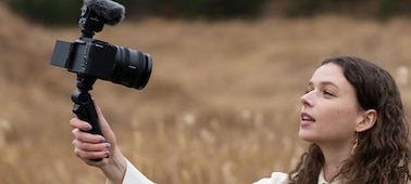 Image of a woman shooting outdoors with a gimbal