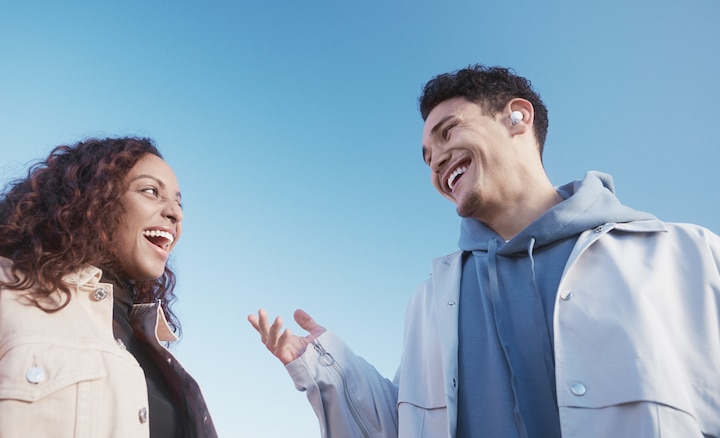 Man and woman talking with the man on right wearing LinkBuds S