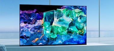 BRAVIA TV in living room on stand in Front position style for immersive viewing with image of colourful glass and crystals on screen